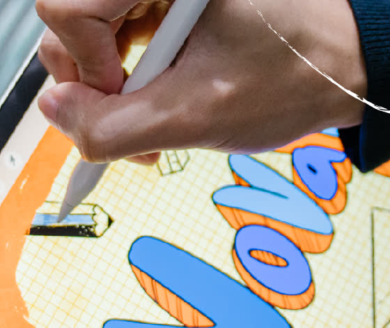 Close-up of a NovaPlus stylus tip writing on an iPad screen